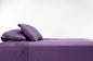100% Bamboo Luxury Sheet in Purple Fitted on a Bed